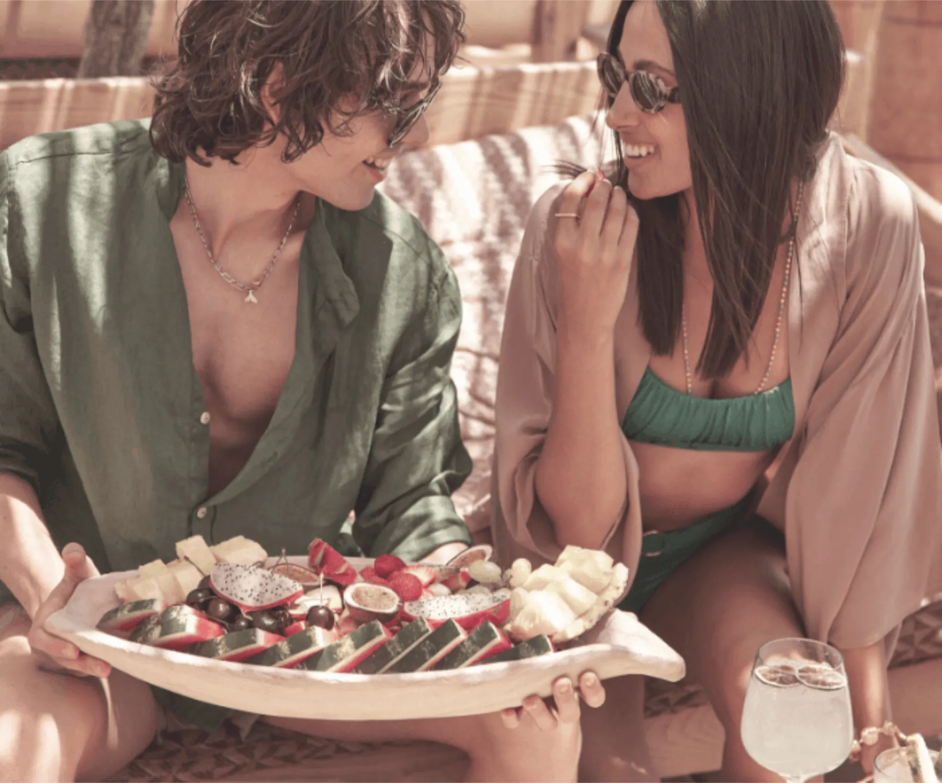 Couple enjoying sushi dishes at SantAnna Mykonos