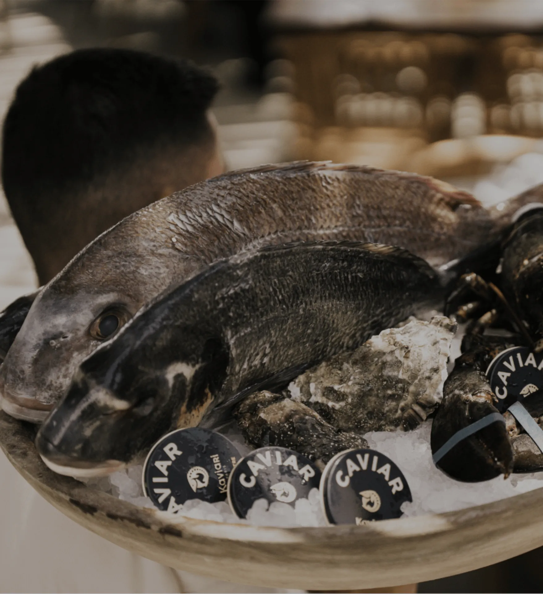 Fresh fish into dish with caviar