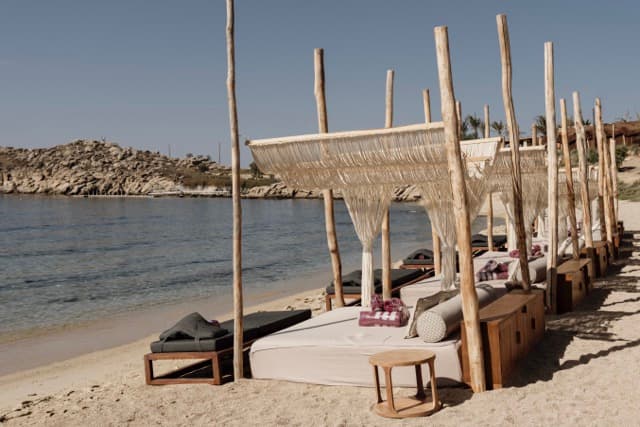 Waterfront Row Cabanas - Area with unobstructed sea views & luxury beach service.